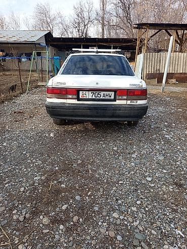 ом 615: Mazda 626: 1990 г., 2 л, Механика, Бензин, Седан — 8