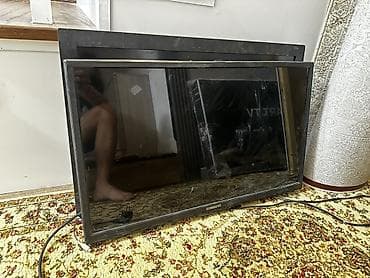 tab a: Телевизор Samsung, диагональ около 32–37". Плоская панель, тонкая — 1