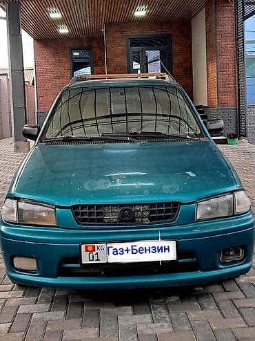 Mazda Demio: 1999 г., 1.3 л, Механика, Гибрид, Хэтчбэк