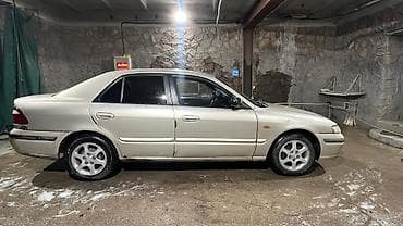глушитель москвич: Mazda 626: 1999 г., 1.8 л, Механика, Газ — 2