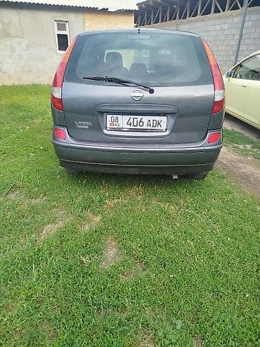 авто выхлоп: Nissan Almera Tino: 2003 г., 1.8 л, Механика, Бензин, Хэтчбэк — 4