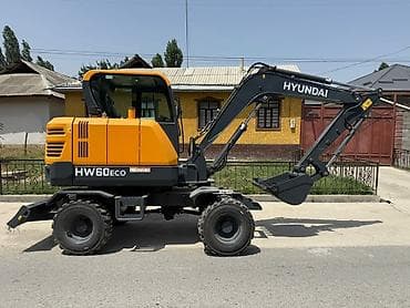 Колесный экскаватор Hyundai HW60ECO в желто-серой цветовой гамме