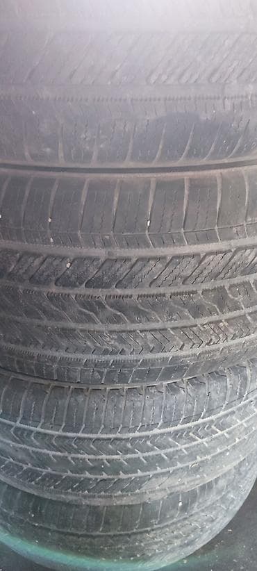 диске: Шины 285 / 45 / R 21, Всесезонная, Комплект, Внедорожные (АТ/МТ), Bridgestone — 2