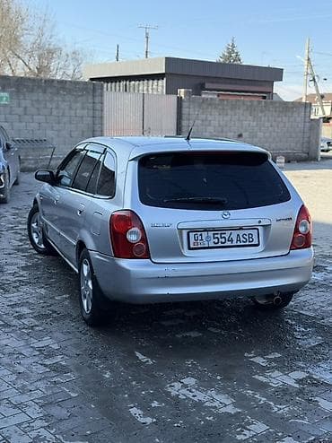 w210 e280: Mazda 323: 2003 г., 1.6 л, Механика, Бензин, Универсал — 3