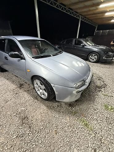 прес ош: Mazda Lantis: 1996 г., 1.5 л, Механика, Бензин, Седан — 6