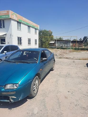 mini cooper: Mazda 323: 1995 г., Хэтчбэк — 4