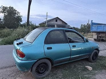 1992: Mazda 121: 1992 г., Механика, Бензин, Седан — 5