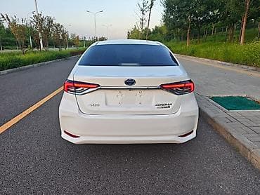 byd e5: Toyota Corolla: 2023 г., 1.8 л, Вариатор, Гибрид, Седан — 9