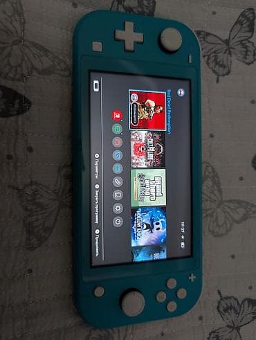 Продаю Nintendo Switch lite консоль чипованная . стоит прошивка