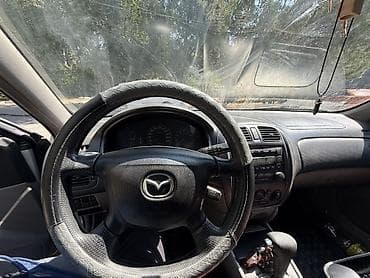 Mazda 323: 2001 г., 1.5 л, Автомат, Бензин, Универсал — 7