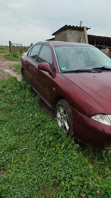 Mitsubishi Carisma: 1999 г., Механика, Бензин, Седан — 1