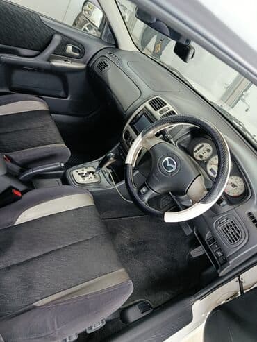 глушитель гольф 2 1.8 бензин: Mazda Familia: 2001 г., 2 л, Автомат, Бензиновая, Универсал — 6