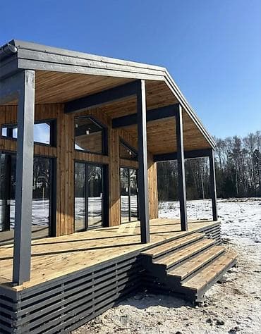 металлокаркасные дома: Каркасный дом в современном стиле с большой террасой и панорамным — 1