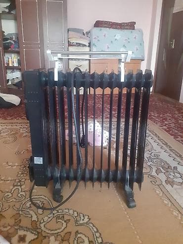 Отопительные приборы: Масляный обогреватель Кол-во секций: 10 и более, Несколько режимов мощности — 2