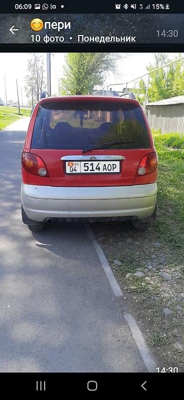 кадамжай авто: Компактный городской хэтчбек красного цвета с серебристым обвесом — 3