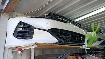 Автозапчасти: Передний бампер с решеткой радиатора для легкового автомобиля. - — 1