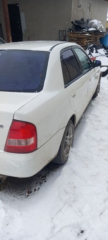 бонго мазда: Mazda Familia: 1999 г., 1.5 л, Автомат, Бензин, Седан — 5
