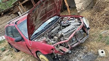 суппорт тормозной: Mazda 323: 2003 г., 1.6 л, Механика, Бензин, Универсал — 4