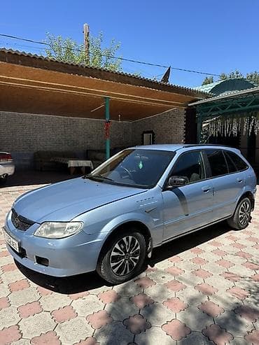 атего 1229: Mazda Familia: 1998 г., 1.8 л, Автомат, Бензин, Универсал — 2
