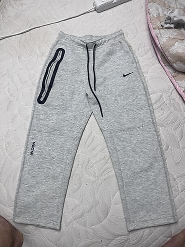 tech fleece: Серые спортивные брюки NOCTA x Nike. - Прямой крой, комфортная — 1