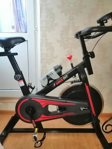 напольный турник 3 в 1: Спин-байк unixfit велотренажёр. Новый В коробке. Во время тренировки — 2