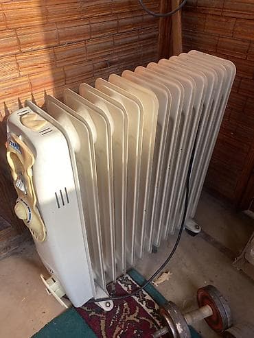 a 40: Масляный обогреватель Кол-во секций: 10 и более, Несколько режимов мощности — 1