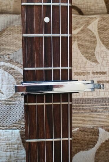 купить струну для гитары: Оригинальные каподастры, универсальные, прочный металл, обмен на — 5