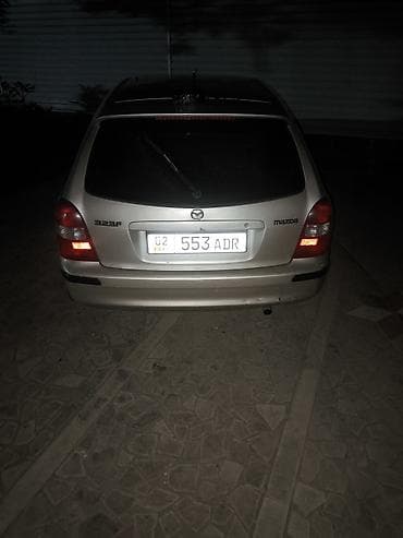 byd e2: Mazda 323: 1999 г., Механика, Бензин, Хэтчбэк — 3