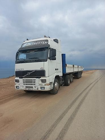 бу кузгу: Услуги грузоперевозок на грузовике Volvo с полуприцепом-площадкой - — 3