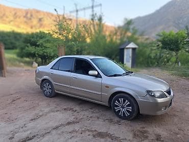 Mazda Familia: 2002 г., 1.6 л, Автомат, Бензин, Седан — 2