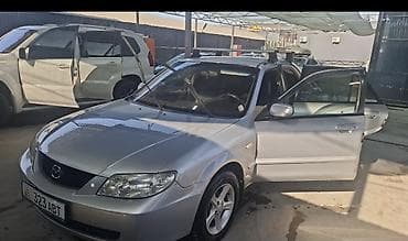 Mazda 323: 2003 г., 1.6 л, Механика, Бензин, Седан