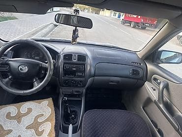 crown 204: Mazda 323: 2001 г., 1.6 л, Механика, Бензин, Хэтчбэк — 6