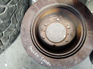 перфорированные тормозные диски: Pajero Sport \ Montero Sport Задний тормозной диск, Митсубиси Паджеро — 1