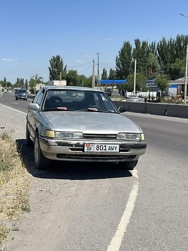 210 mers: Mazda 626: 1988 г., 2.2 л, Механика, Бензин, Седан — 4