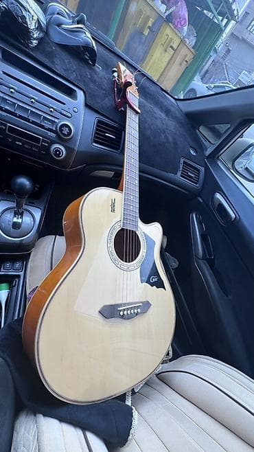 Акустическая гитара с вырезом (cutaway) - Корпус джамбо с вырезом для