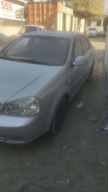 дом на калеса: Шевролет Лачетти Седан светло‑серебристого цвета. Основные — 8