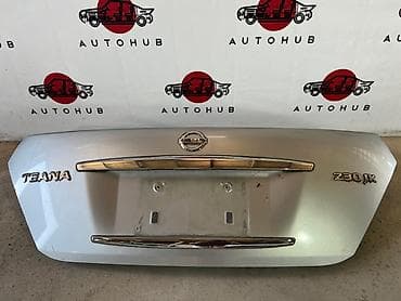 Автокосметика: Багажниктин капкагы Nissan, 2003 г., Оригинал — 1