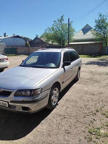 глушитель на макси: Mazda 626: 1998 г., 1.8 л, Механика, Бензин, Универсал — 6
