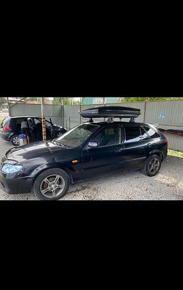 corolla e150: Mazda 323: 2002 г., 1.6 л, Бензин, Хэтчбэк — 2