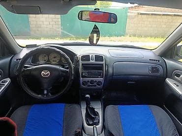 моторчик печки 124: Mazda 323: 2001 г., 2 л, Механика, Бензин, Хэтчбэк — 8