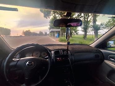 Mazda Familia: 2002 г., Хэтчбэк — 2