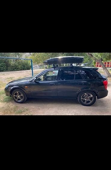 corolla e150: Mazda 323: 2002 г., 1.6 л, Бензин, Хэтчбэк — 5