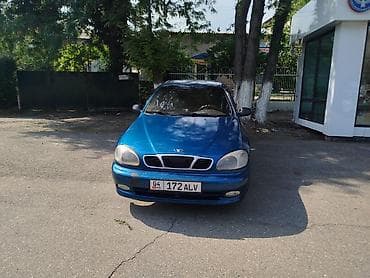 Транспорт: Daewoo Lanos: 1999 г., Бензин, Седан — 1