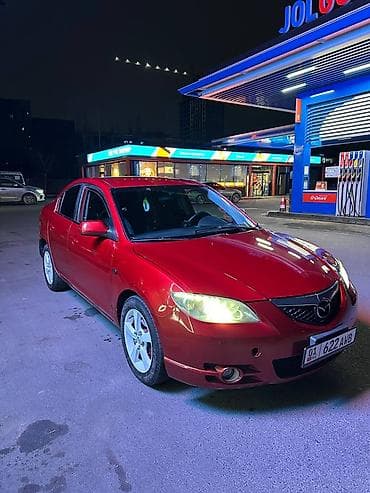 руль и педали: Mazda 3: 2006 г., Механика, Бензин, Седан — 2