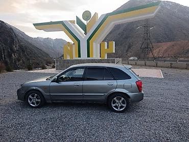 daf 480: Mazda 323: 2002 г., 1.6 л — 4