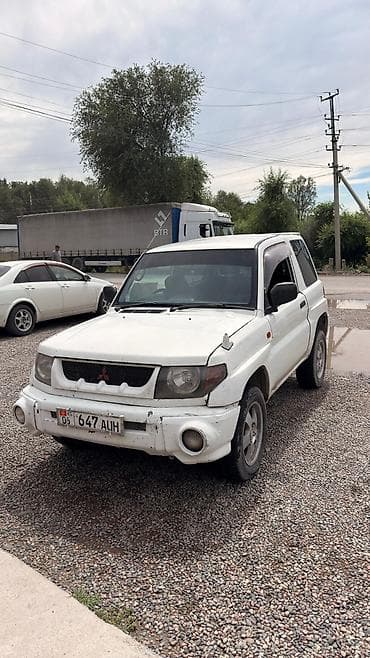 Транспорт: Mitsubishi Pajero iO: 1998 г., 1.8 л, Механика, Бензин, Внедорожник — 7