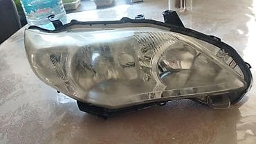 Правый передняя фара для автомобиля Toyota Corolla (E150