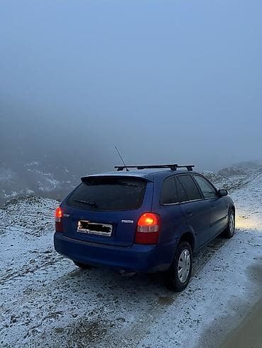 кытай мото: Mazda 323: 2000 г., 2 л, Кол менен иштөөчү, Дизель, Хетчбек — 5