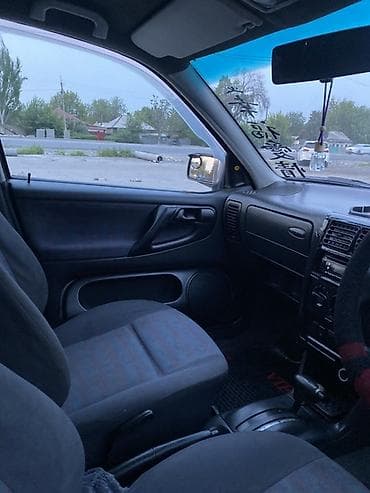 боковой тырмо: Volkswagen Polo: 1999 г., 1.6 л, Автомат, Бензин, Хэтчбэк — 9