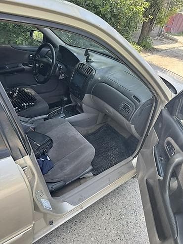 Продажа авто: Mazda 323: 2002 г., 1.6 л, Автомат, Бензин, Седан — 5